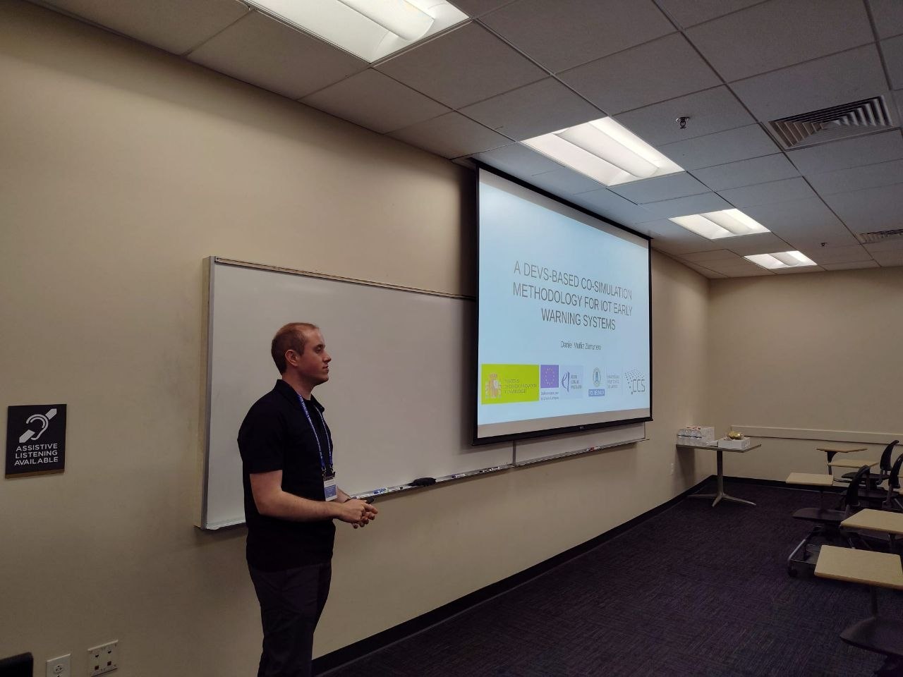 Daniel Muñiz during the PhD Colloquium “A DEVS-BASED CO-SIMULATION METHODOLOGY FOR IOT EARLY WARNING SYSTEMS”